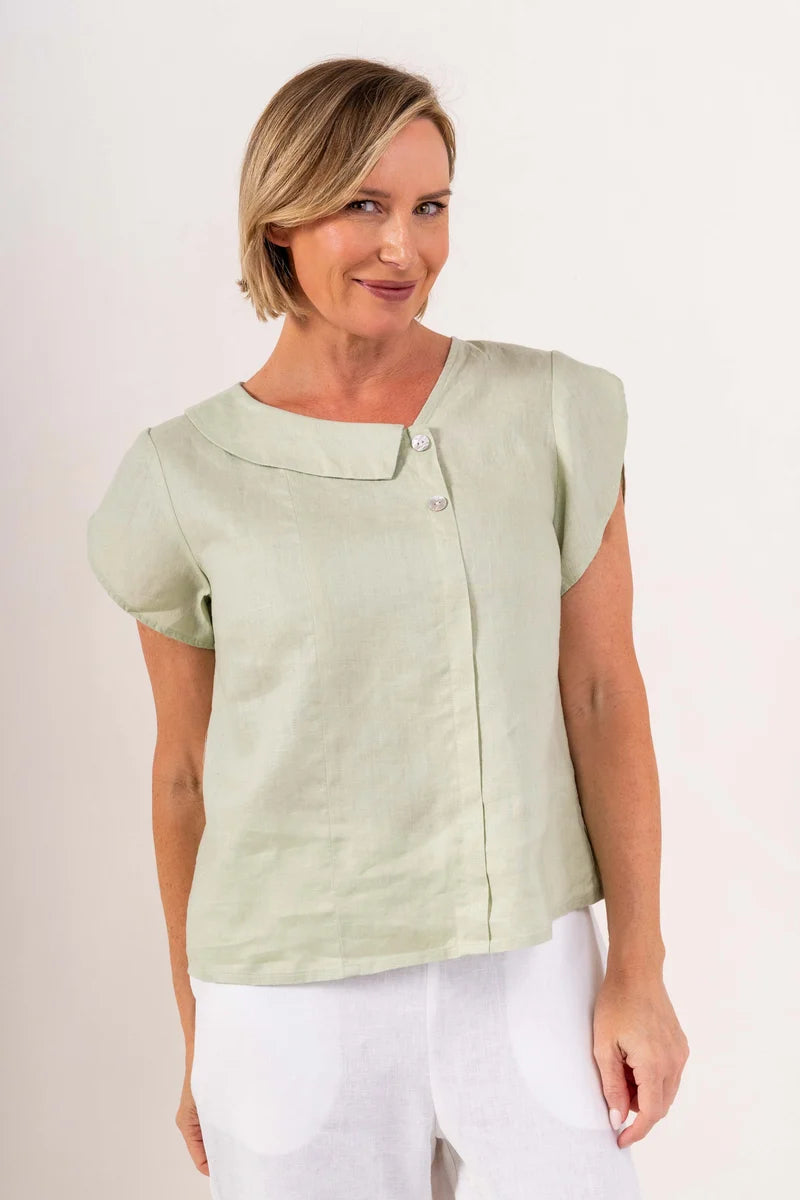 2 Button Cowl Neck Linen Top featuring an asymmetric two-button neckline, flutter sleeves, centre pintuck detail and relaxed fit, available in white and sage.