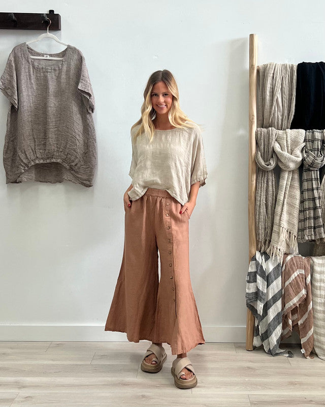 The Clay Bruna Button Wide Legged Pants by Rustic Linen are available at Rawspice Boutique.