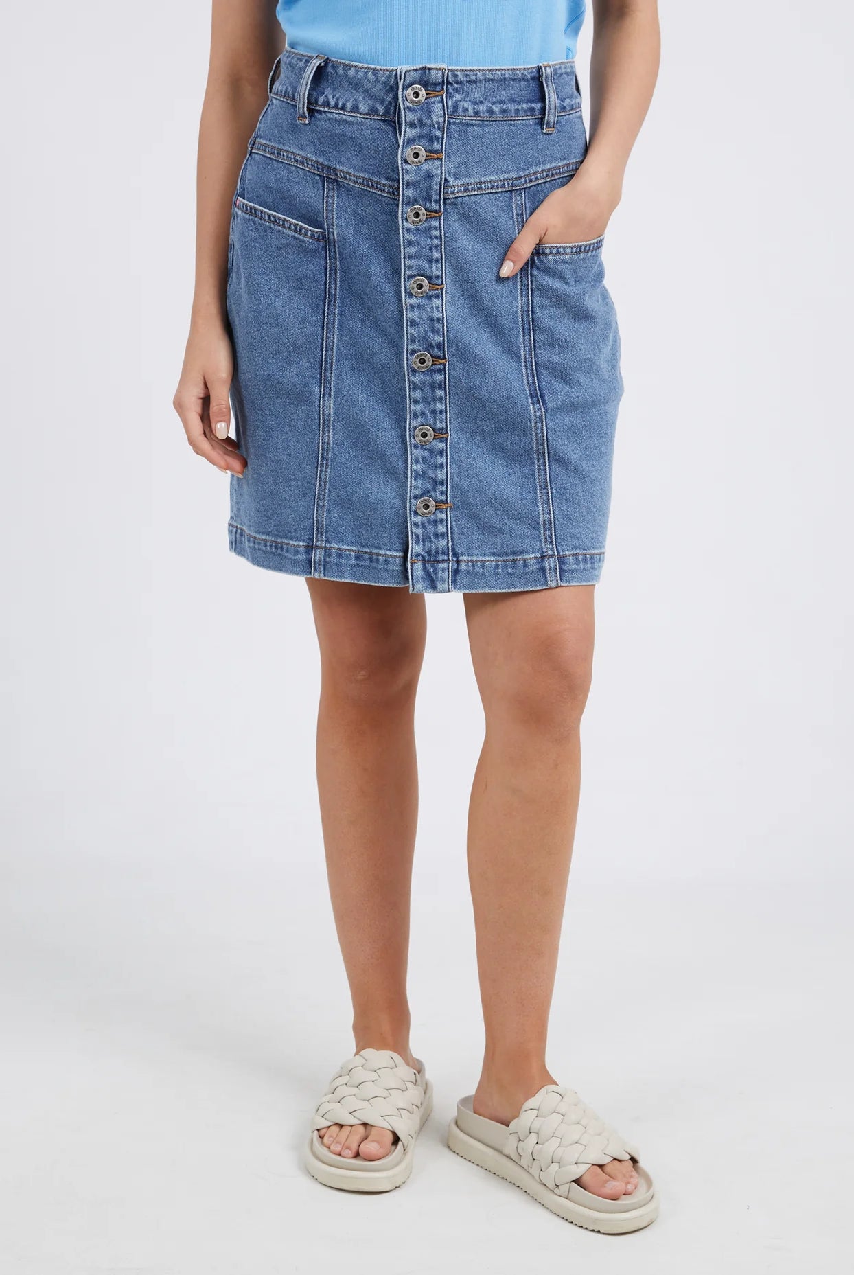 The Blue Eliza Denim Skirt by Elm is currently available at Rawspice Boutique.