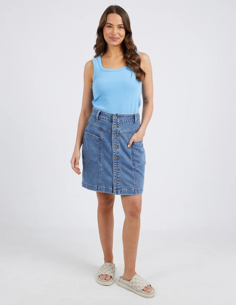 The Blue Eliza Denim Skirt by Elm is currently available at Rawspice Boutique.