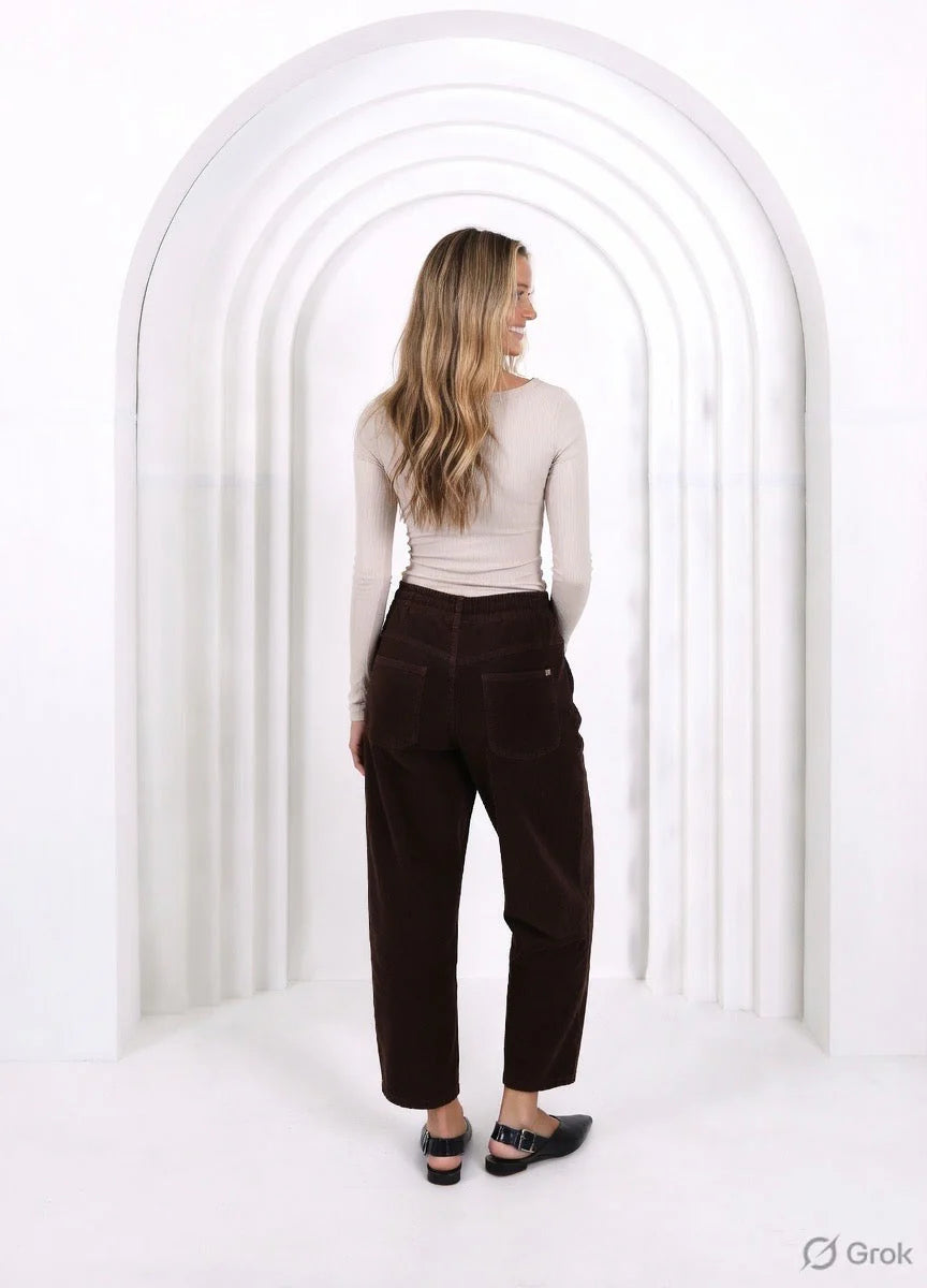 Relaxed and comfortable Leo Barrel Jeans in Chocolate, featuring a trendy barrel-leg fit, elastic drawstring waist, pockets and belt loops.