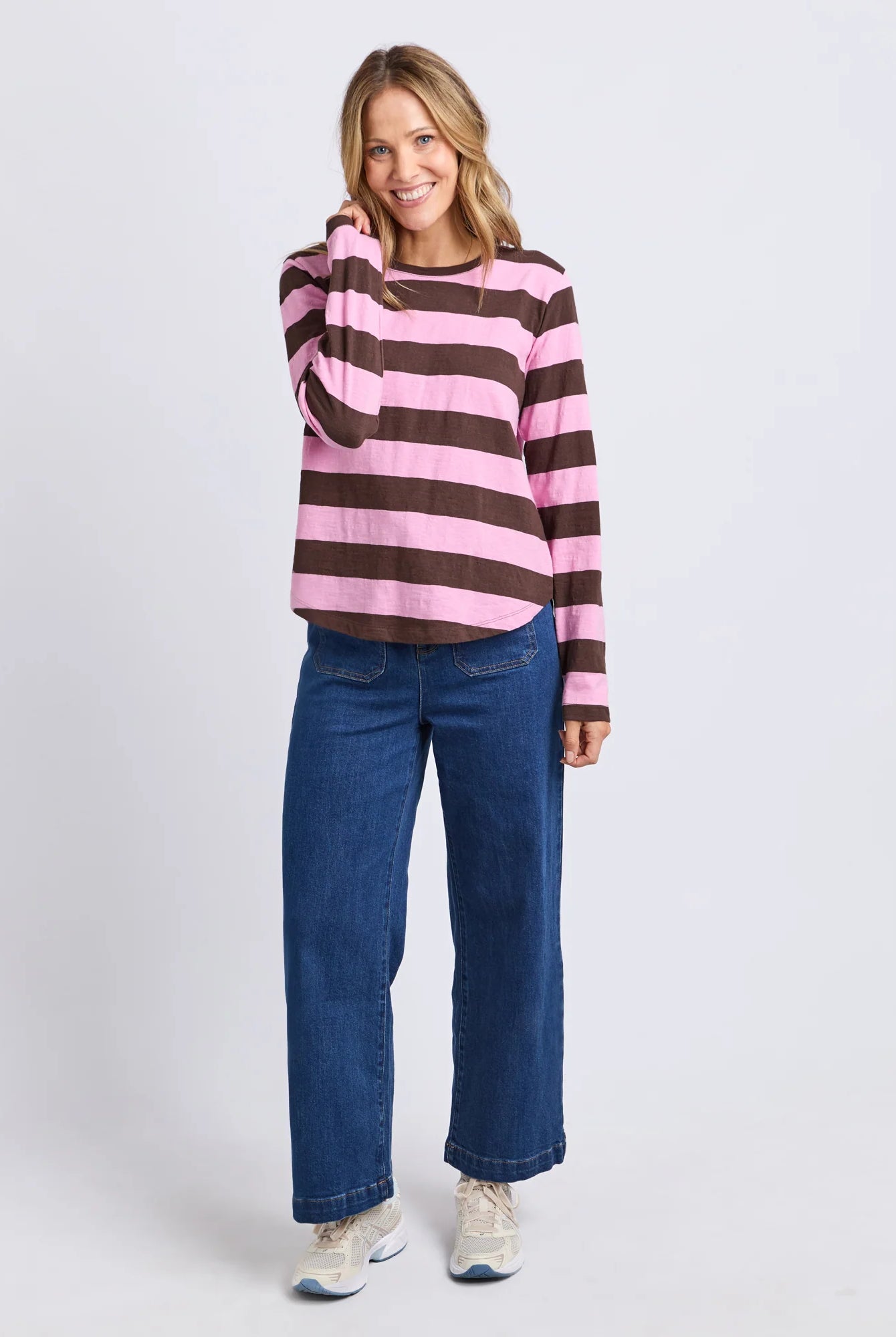 Yarn-dye stripe cotton slub jersey top with a curved hemline, lightweight feel, and relaxed fit ideal for layering.
