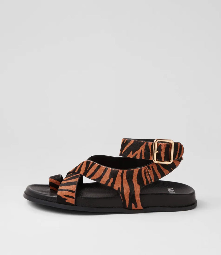  The Huiro Black Tan Zebra Pony Sandals by Mollini are currently available at Rawspice Boutique. 