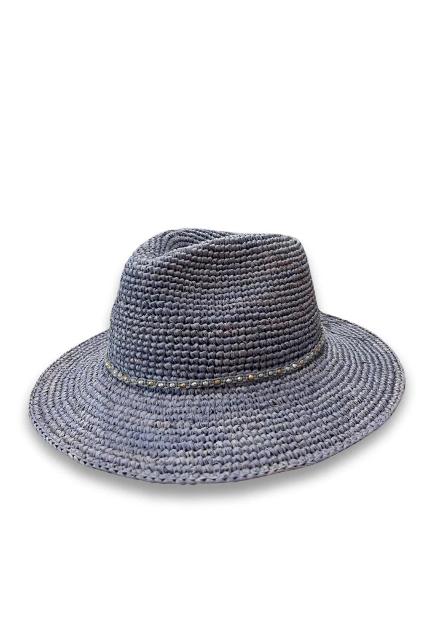 Magdalena hand-woven raffia fedora hat with teardrop crown, metallic beaded trim and wide brim, shown in natural Madagascan raffia.