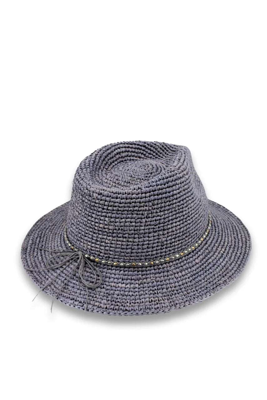 Magdalena hand-woven raffia fedora hat with teardrop crown, metallic beaded trim and wide brim, shown in natural Madagascan raffia.