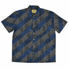Men’s short sleeve bamboo shirt with chest pocket, bamboo wood-look buttons, and a design inspired by Warlpiri Jukurrpa, made from bamboo fiber and cotton blend.