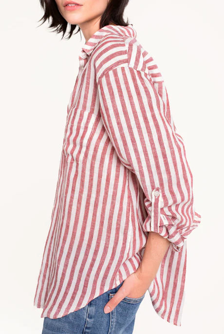 Boyfriend linen shirt in rhubarb stripe, designed with a relaxed fit, French seams, tab sleeves, and a flattering scoop hem. Crafted for comfort and effortless style.