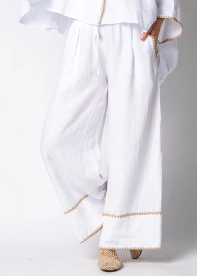 White full-length linen pants made from 100% lightweight, breathable linen. Designed with an airy, relaxed cut for unrestricted movement and all-day comfort, offering a clean, timeless look suitable for warm-weather wear