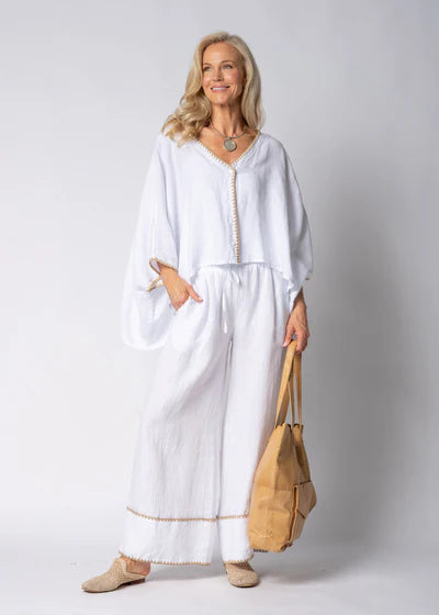 White full-length linen pants made from 100% lightweight, breathable linen. Designed with an airy, relaxed cut for unrestricted movement and all-day comfort, offering a clean, timeless look suitable for warm-weather wear