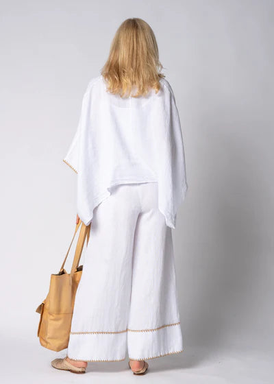 White full-length linen pants made from 100% lightweight, breathable linen. Designed with an airy, relaxed cut for unrestricted movement and all-day comfort, offering a clean, timeless look suitable for warm-weather wear