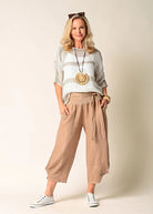 The Addison Linen Pant in Desert. Breathable linen trousers with a tie waist and side pockets, styled for relaxed, everyday elegance.