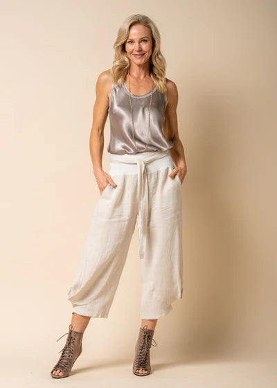 The Addison Linen Pant in Latte. Breathable linen trousers with a tie waist and side pockets, styled for relaxed, everyday elegance.