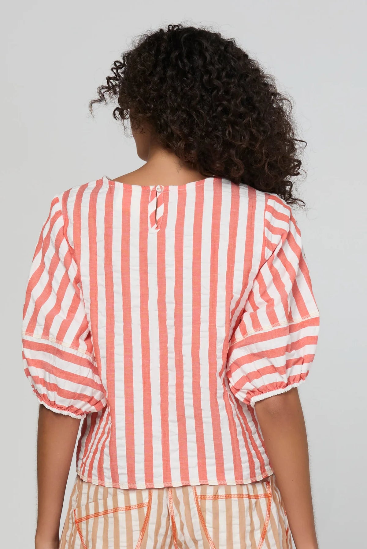 Boom Shankar Ava Top in Watermelon Stripe featuring coral and white stripes, elbow-length puff sleeves, a round neckline and cropped length.
