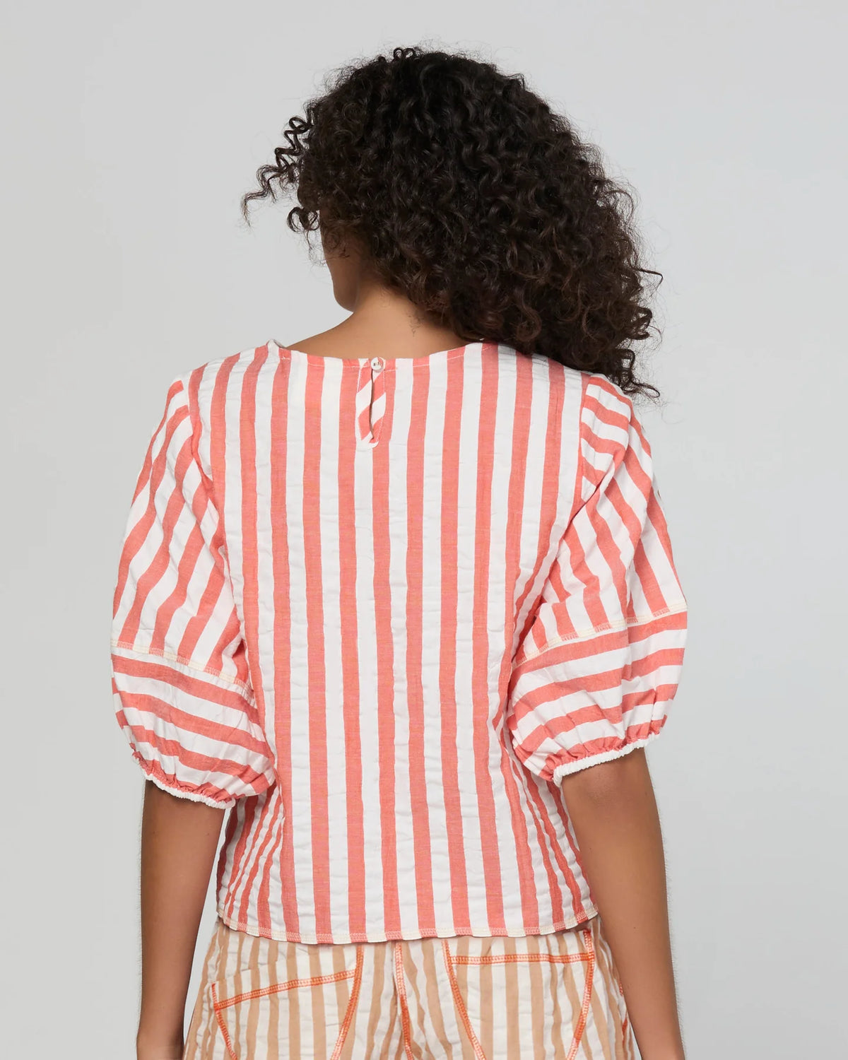 Boom Shankar Ava Top in Watermelon Stripe featuring coral and white stripes, elbow-length puff sleeves, a round neckline and cropped length.