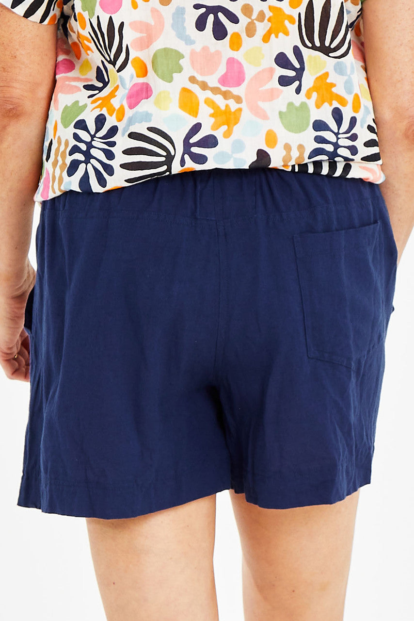White lightweight cotton beach shorts for coastal summer wear