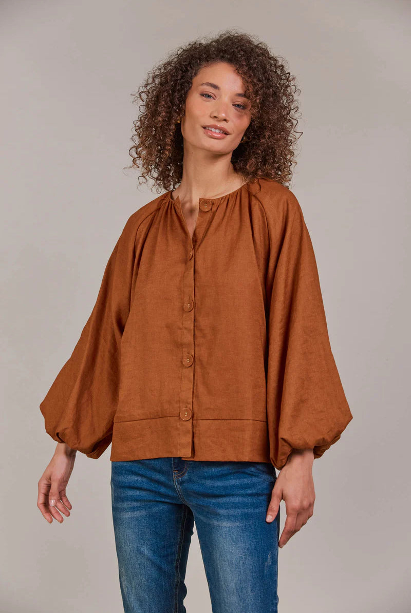Hazel linen-cotton blend blouse with a collarless neckline, voluminous bishop sleeves, and a relaxed, hip-length silhouette for a stylish, contemporary look.
