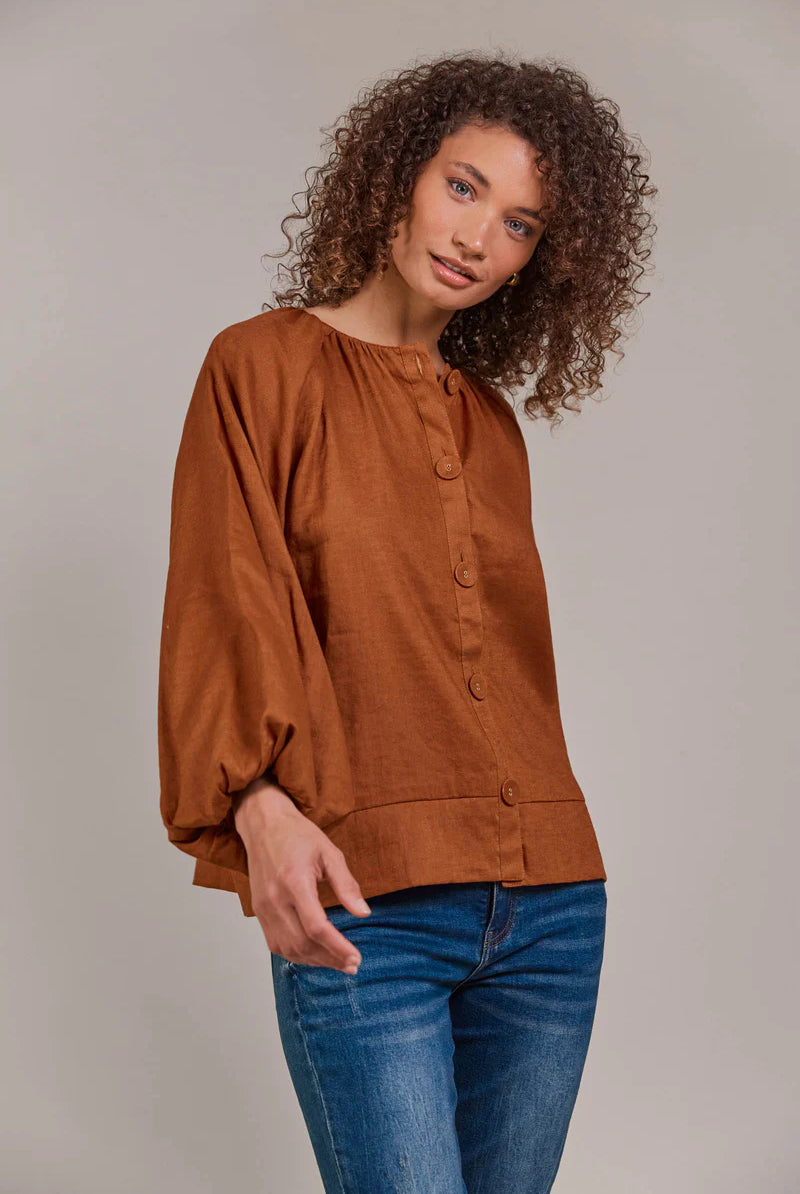 Hazel linen-cotton blend blouse with a collarless neckline, voluminous bishop sleeves, and a relaxed, hip-length silhouette for a stylish, contemporary look.