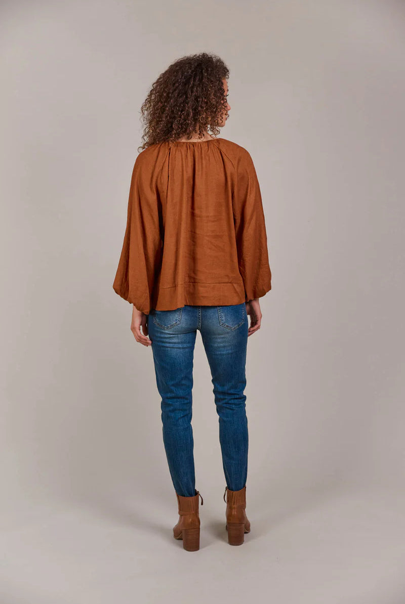 Hazel linen-cotton blend blouse with a collarless neckline, voluminous bishop sleeves, and a relaxed, hip-length silhouette for a stylish, contemporary look.
