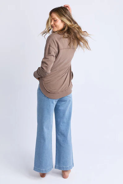 Foxwood Simplified Crew in chocolate brown with round neck, raw edge details, and side splits for a relaxed, everyday look.