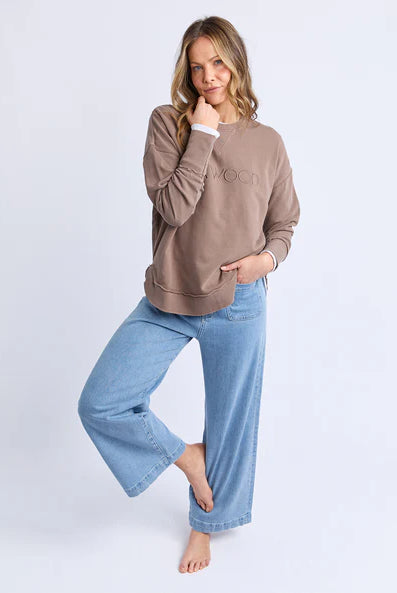 Foxwood Simplified Crew in chocolate brown with round neck, raw edge details, and side splits for a relaxed, everyday look.