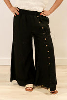 The Black Bruna Button Wide Legged Pants by Rustic Linen are available at Rawspice Boutique.