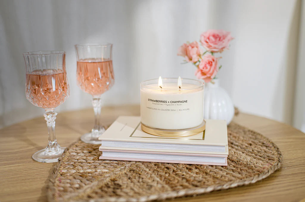 Meeraboo Gold Lid Soy Candle in a clear glass vessel with a brushed gold lid and double wicks, hand-poured with soy wax for long-lasting fragrance.