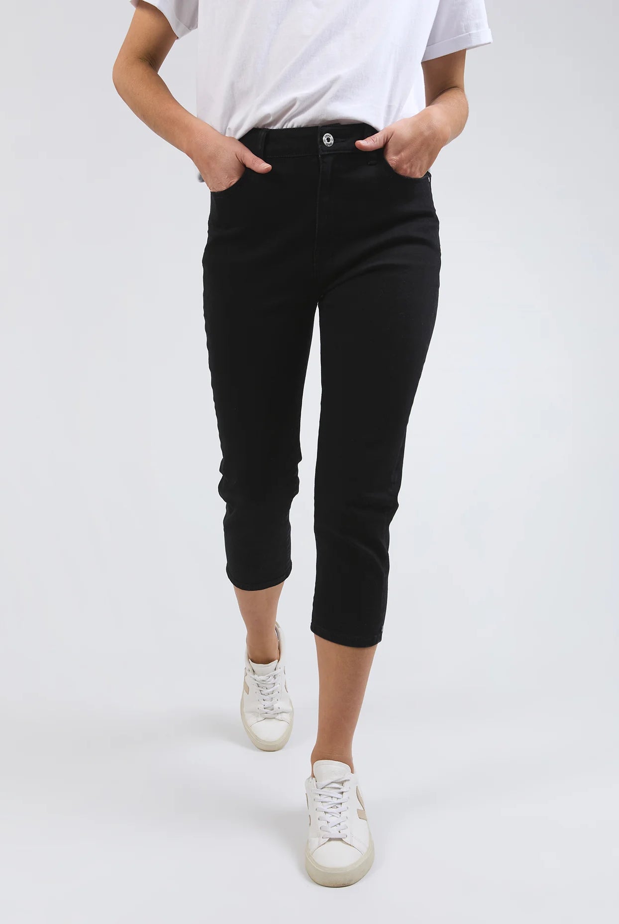 Black Mollie Capri Jeans featuring a slim, cropped leg for a flattering fit. Made from soft stretch denim with a classic 5-pocket design, calf-length cut, and Elm-stamped hardware. The comfortable button-and-fly fastening makes them a practical choice for effortless style. Crafted from 78% cotton, 20% polyester, and 2% elastane for a perfect balance of comfort and flexibility.
