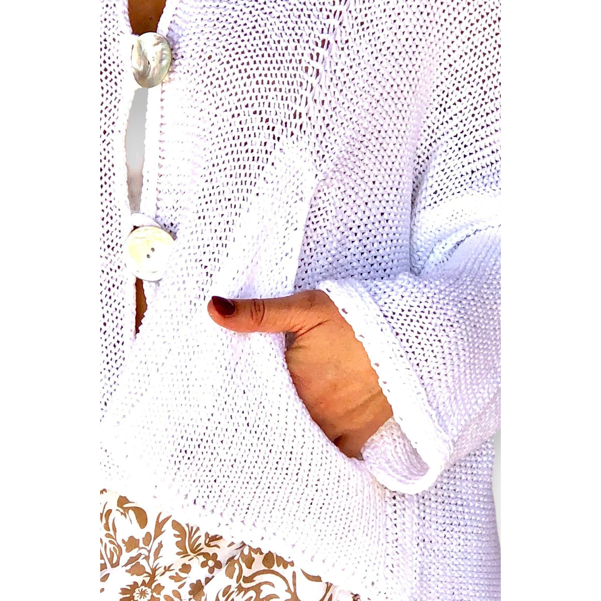 Capri Cardigan featuring a soft swing silhouette, European cotton knit, practical side pockets and delicate mother-of-pearl buttons.