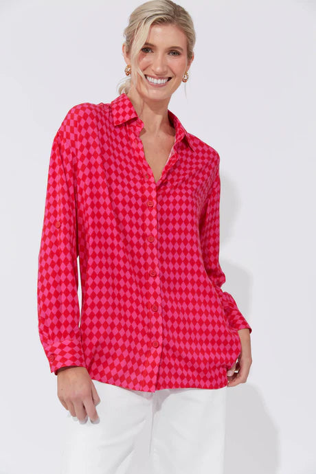 Casablanca Top in Chilli/Pink featuring a collar, button-down front, drop shoulders, long cuffed sleeves with tab detail, and a curved high-low hem.