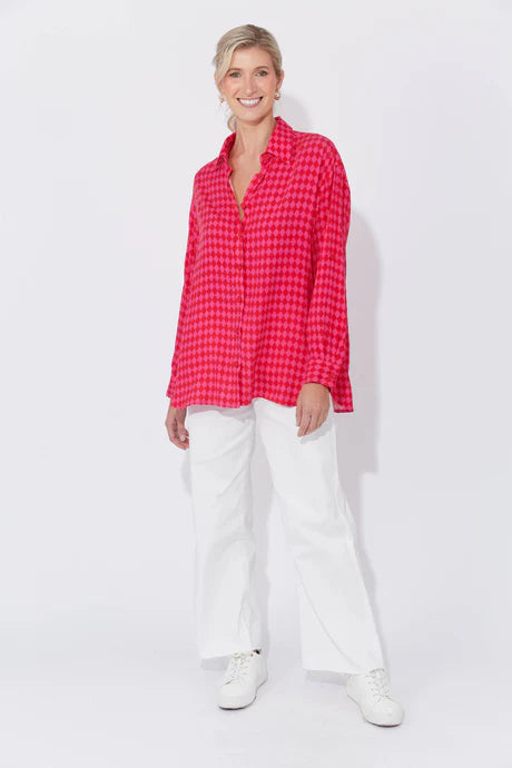 Casablanca Top in Chilli/Pink featuring a collar, button-down front, drop shoulders, long cuffed sleeves with tab detail, and a curved high-low hem.