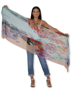 City of Masquerades scarf by Jennifer Gabbay, featuring vibrant, intricate designs inspired by Venice's Carnevale di Venezia, capturing the beauty of masks and costumes against the backdrop of canals.