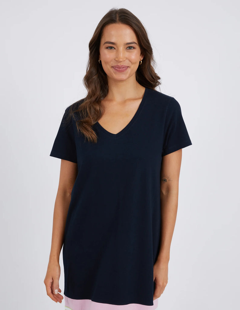 The Navy & Keylime Draw The Line Tee Dress by Elm is currently available at Rawspice Boutique. 
