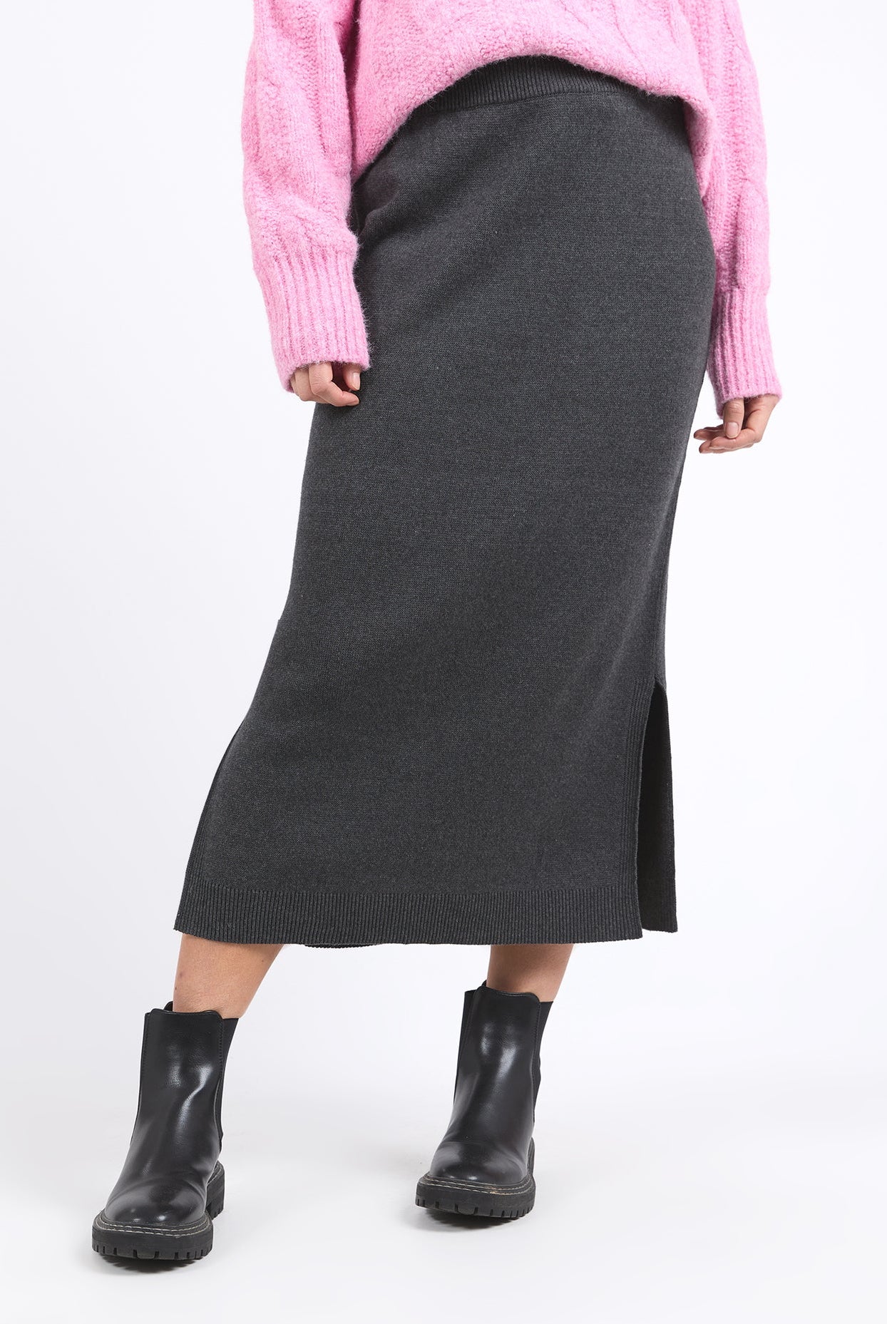 Charcoal marle knit skirt with calf-length cut, side splits, and an elastic waist, offering a flattering and versatile fit for every season.