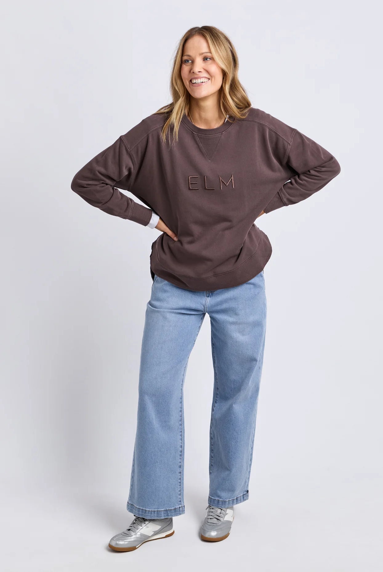 Established Crew in Coffee with chest embroidery, raw hem detail, scooped hemline and a relaxed fit in 100% cotton fleece.