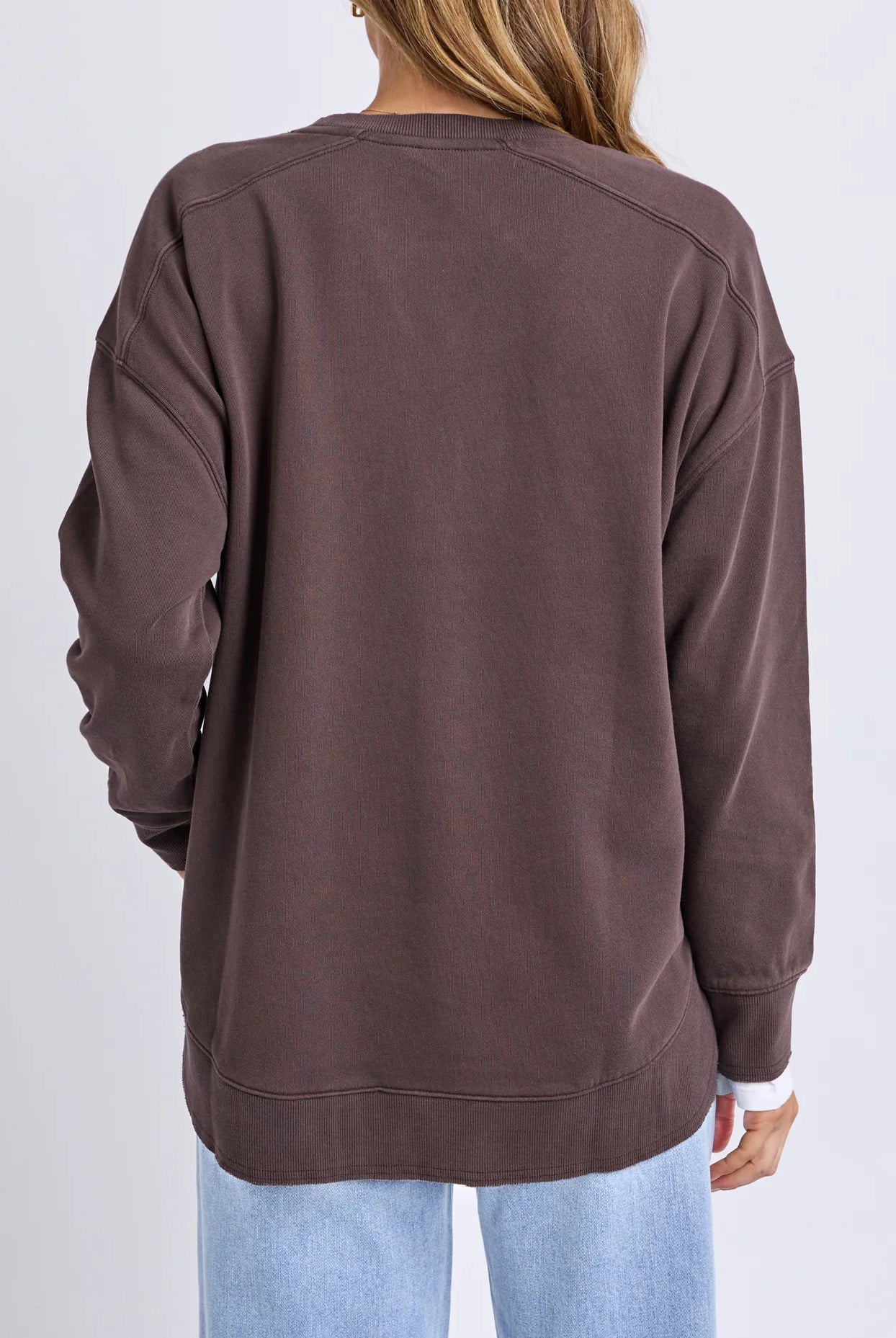 Established Crew in Coffee with chest embroidery, raw hem detail, scooped hemline and a relaxed fit in 100% cotton fleece.