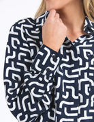 Gemma Geo Shirt in navy with a white geometric print, featuring a classic fit, button-down front, and lightweight fabric for versatile, everyday styling.