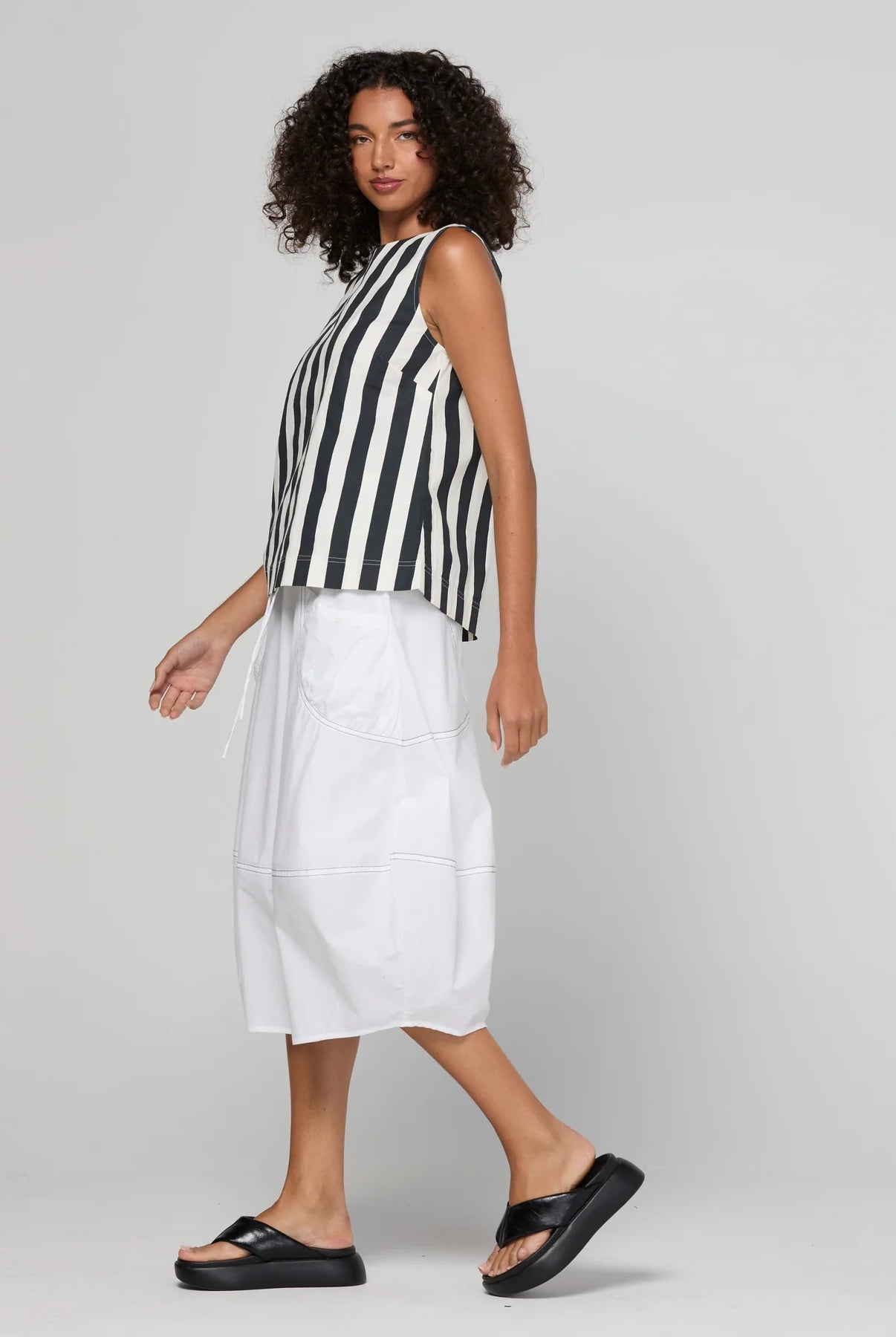Guru Skirt in Coconut featuring a 3/4 length, stretch drawstring waistband, front and back pockets, full lining and black contrast stitching.
