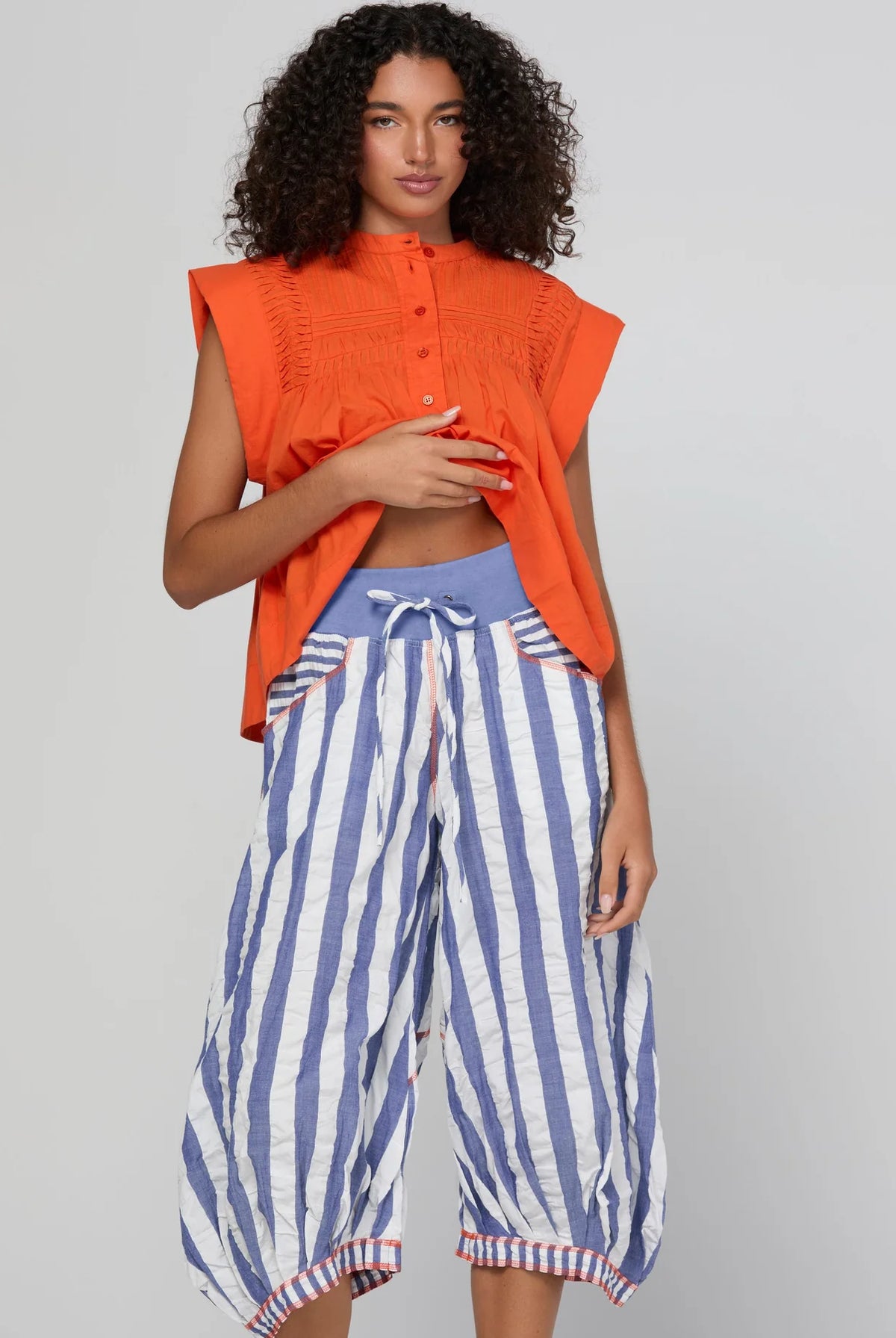 Boom Shankar Guru Pant in Ocean Stripe featuring blue and white stripes, a drawstring waistband, balloon-style legs and 3/4 length.