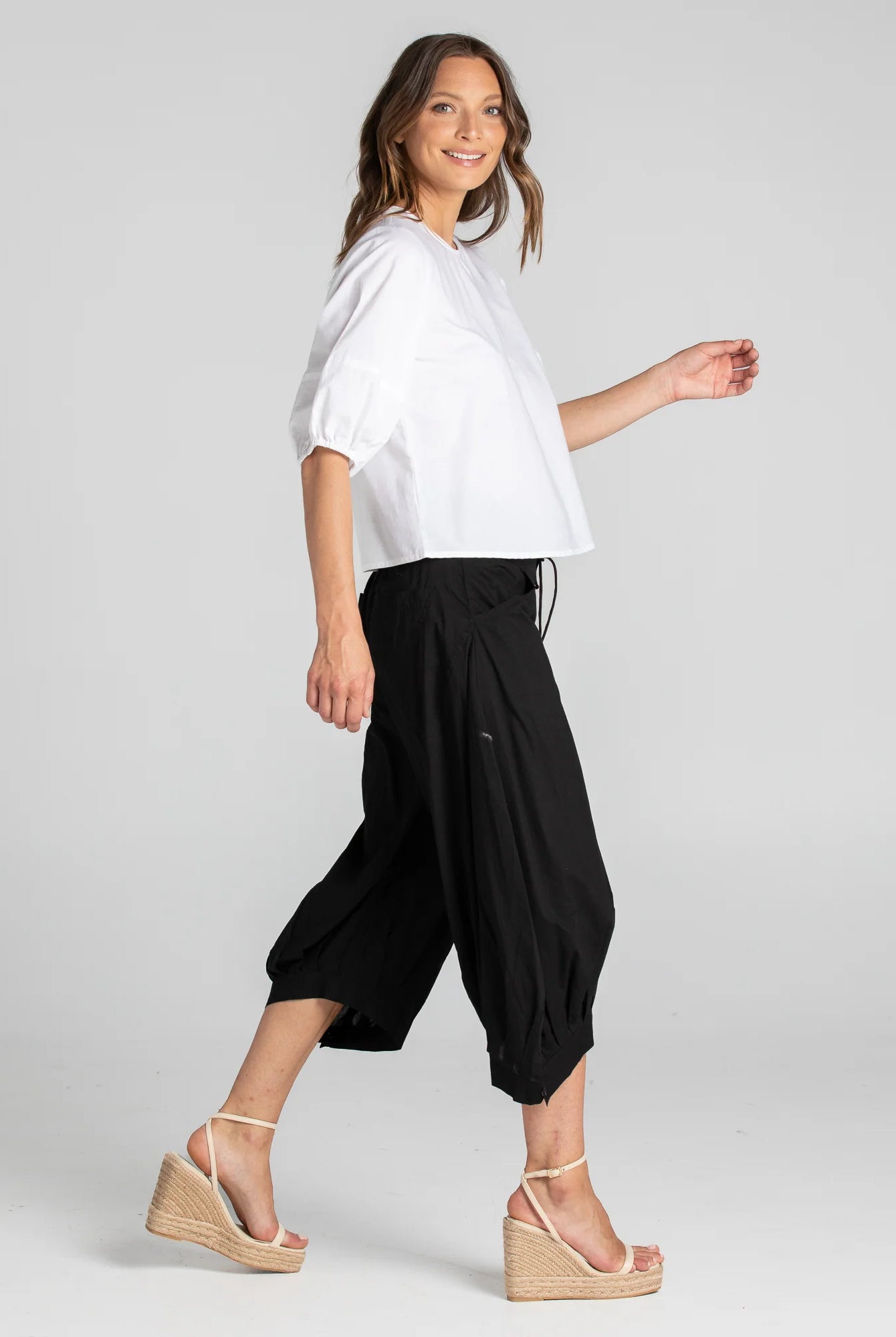 Boom Shankar Guru Pant in Coffee, featuring a relaxed fit with a drawstring waistband, 3/4 length, front and back pockets, and signature seam detailing.