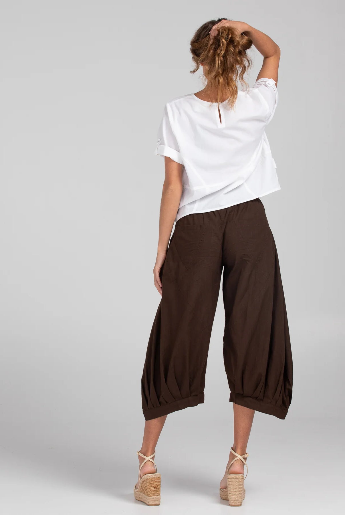 Boom Shankar Guru Pant in Coffee, featuring a relaxed fit with a drawstring waistband, 3/4 length, front and back pockets, and signature seam detailing.