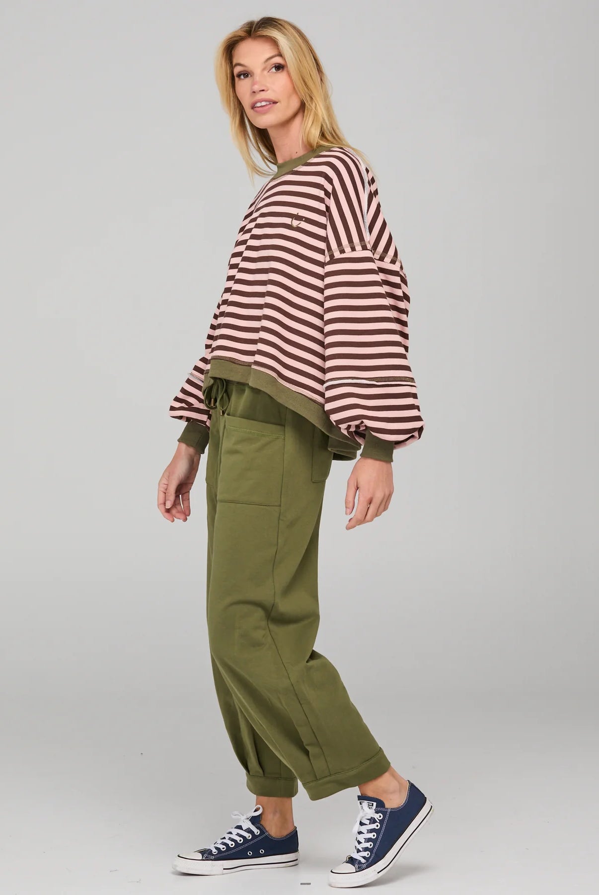 Dusty pink striped oversized sweater with cropped fit, balloon sleeves, ribbed trims and contrast stitching detail.