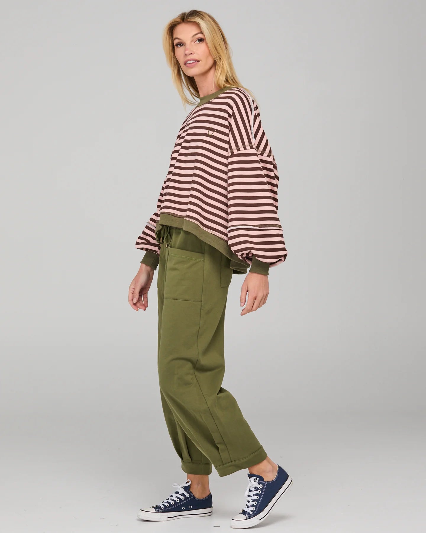 Dusty pink striped oversized sweater with cropped fit, balloon sleeves, ribbed trims and contrast stitching detail.