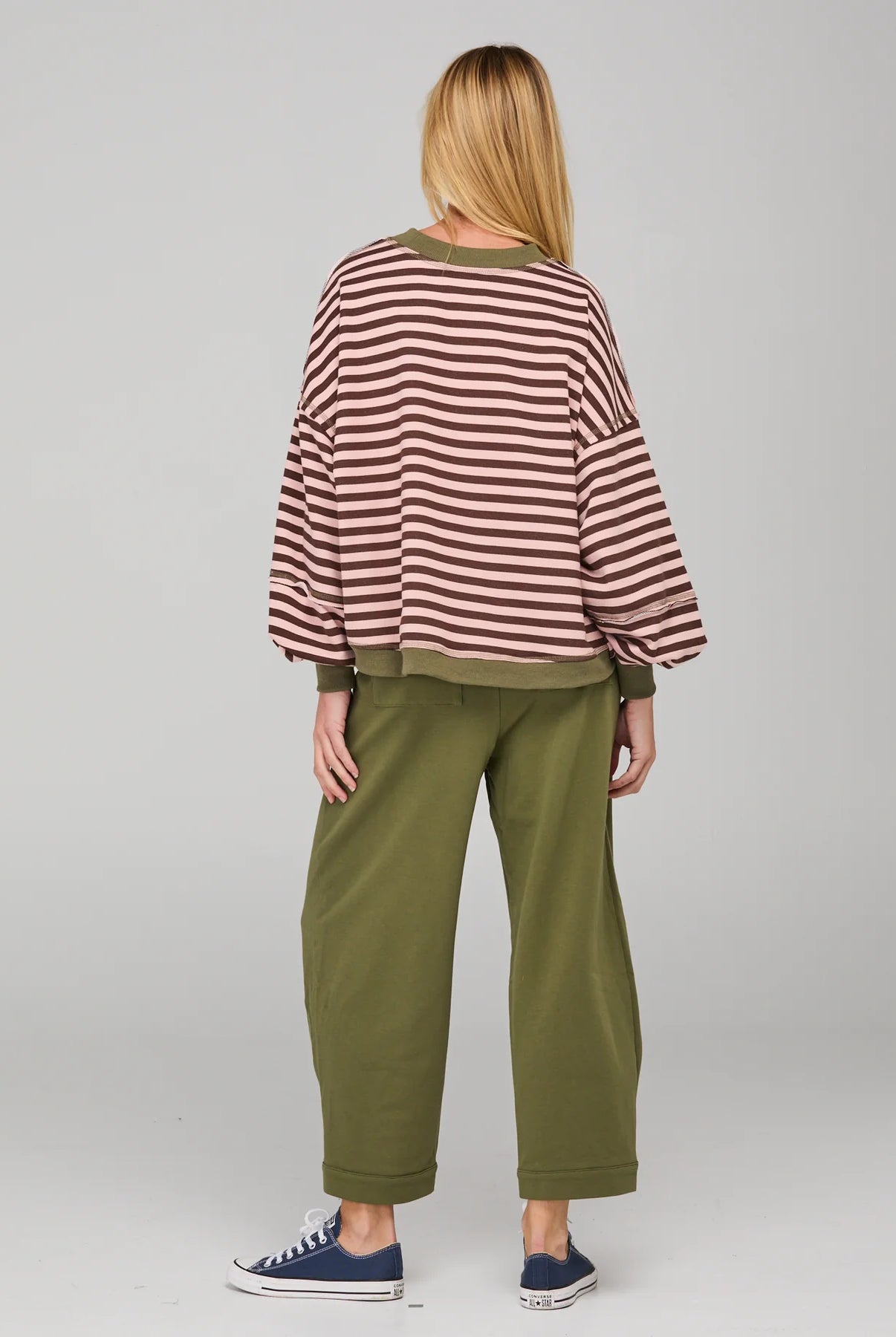 Dusty pink striped oversized sweater with cropped fit, balloon sleeves, ribbed trims and contrast stitching detail.