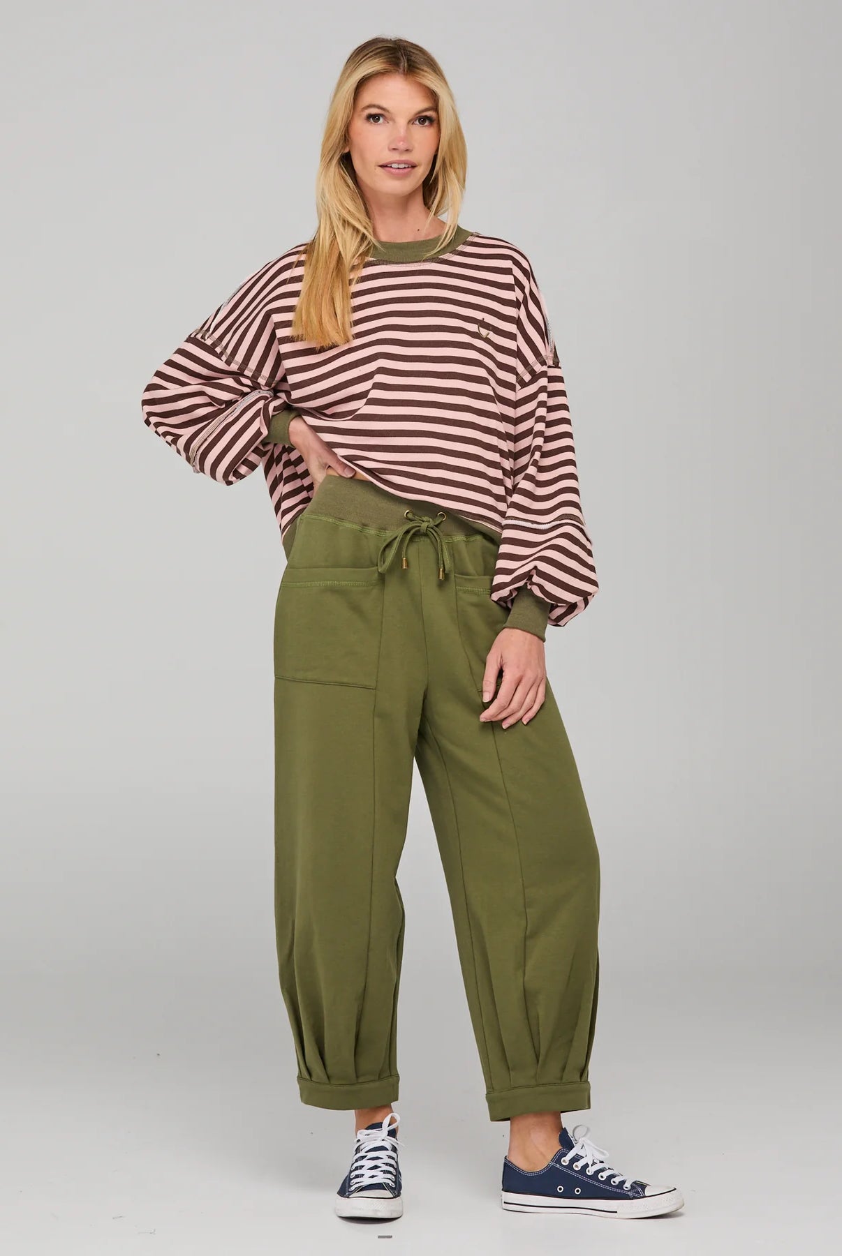 Khaki relaxed fit track pants with drawstring waist, ribbed waistband, contrast stitching and pockets front and back.