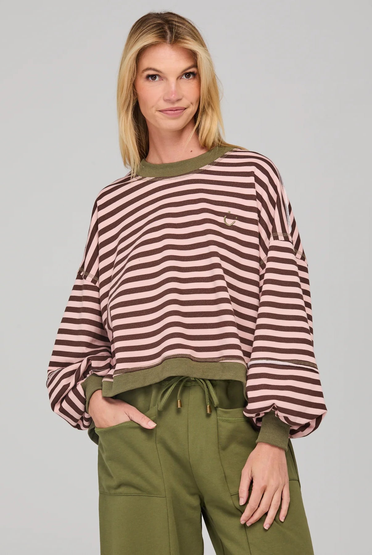 Dusty pink striped oversized sweater with cropped fit, balloon sleeves, ribbed trims and contrast stitching detail.