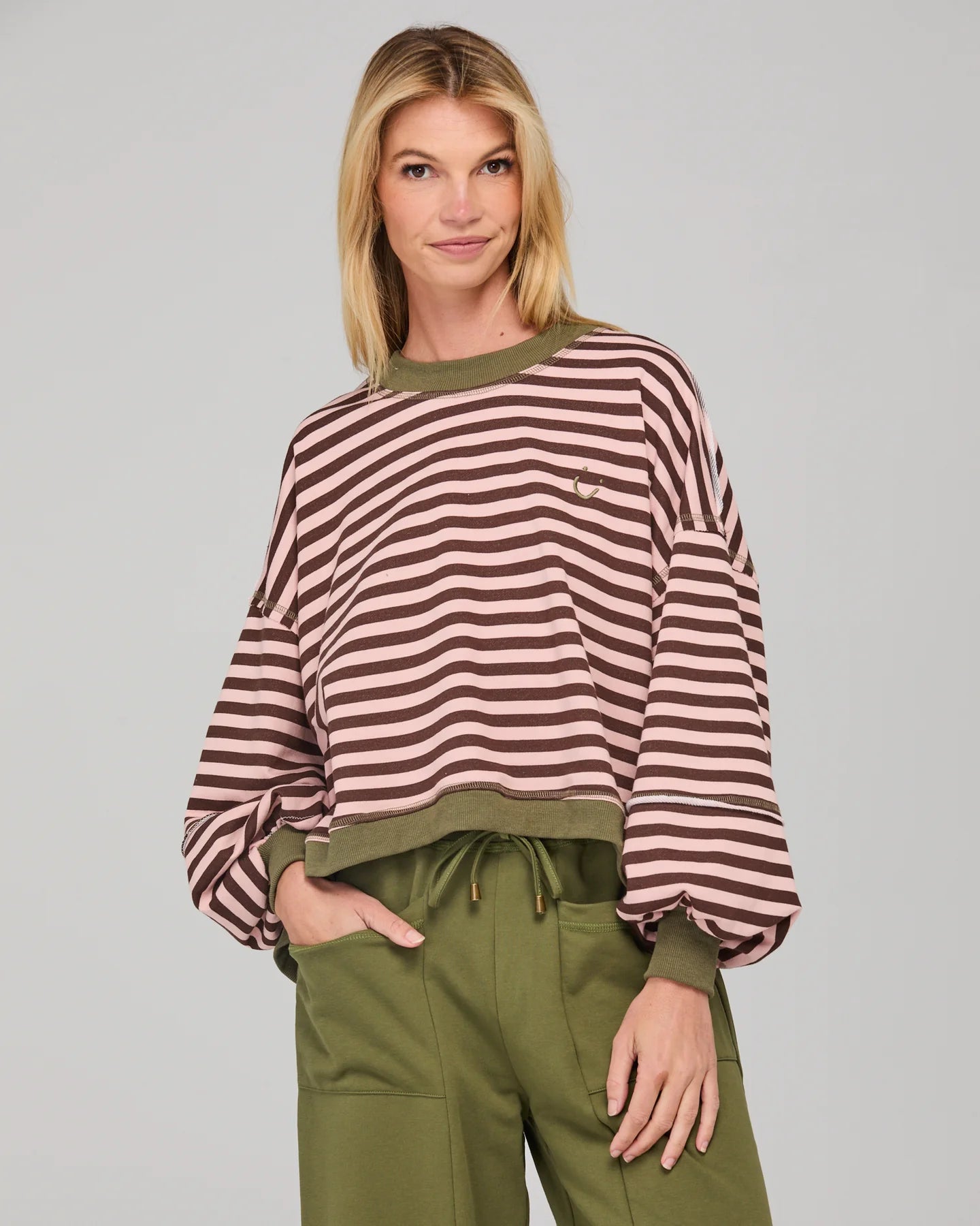 Dusty pink striped oversized sweater with cropped fit, balloon sleeves, ribbed trims and contrast stitching detail.