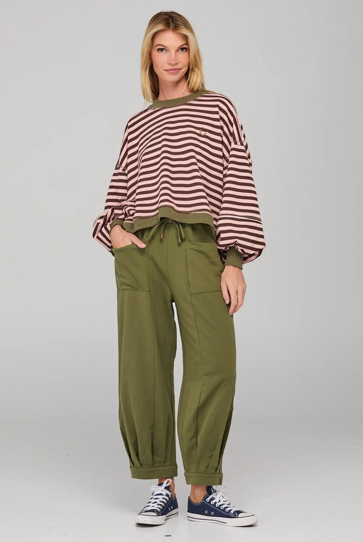 Khaki relaxed fit track pants with drawstring waist, ribbed waistband, contrast stitching and pockets front and back.