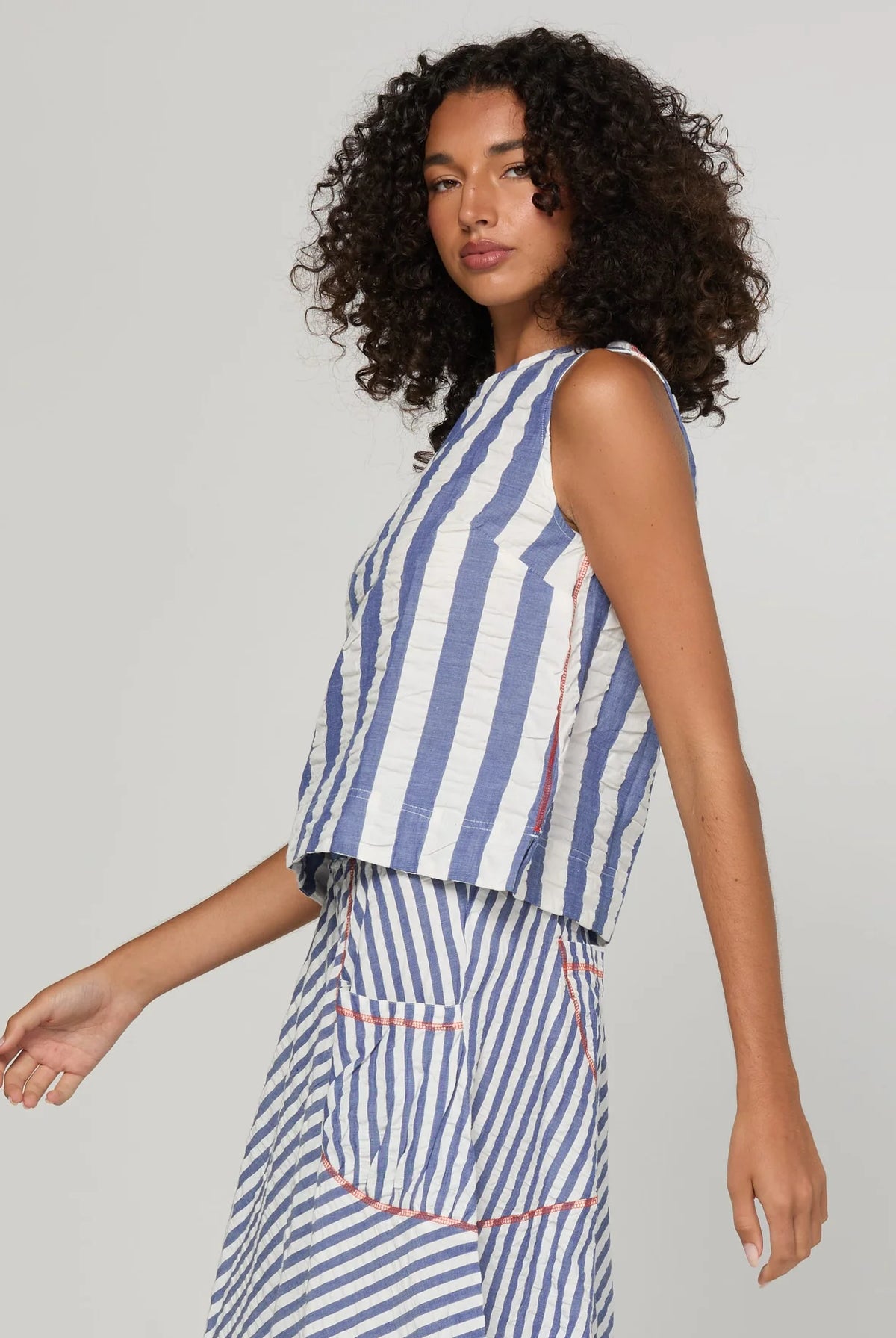 Boom Shankar Hara Top in Ocean Stripe featuring vertical stripes, a high scoop neckline, sleeveless design and fitted silhouette.