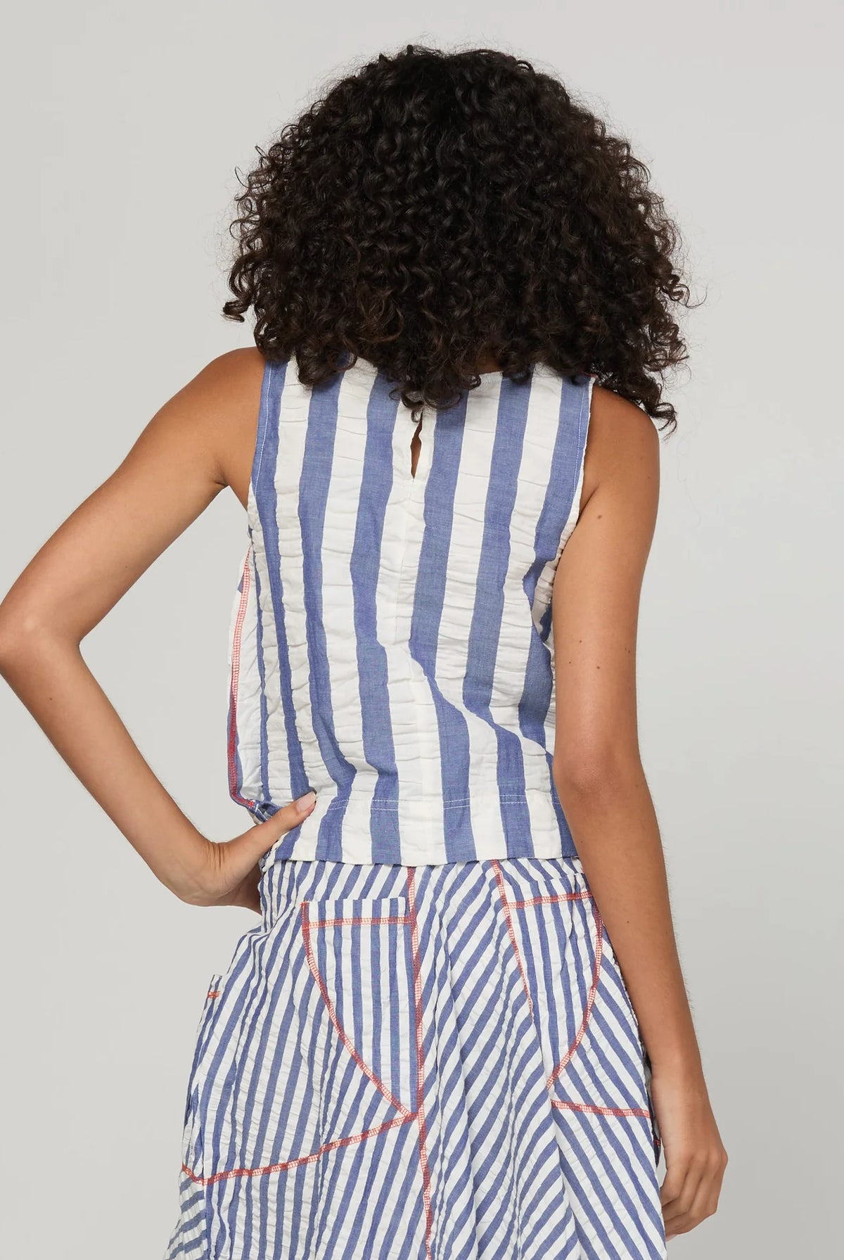 Boom Shankar Hara Top in Ocean Stripe featuring vertical stripes, a high scoop neckline, sleeveless design and fitted silhouette.