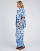 Add a pop of style to your wardrobe with the Postcard Print Holiday Sun Pants.